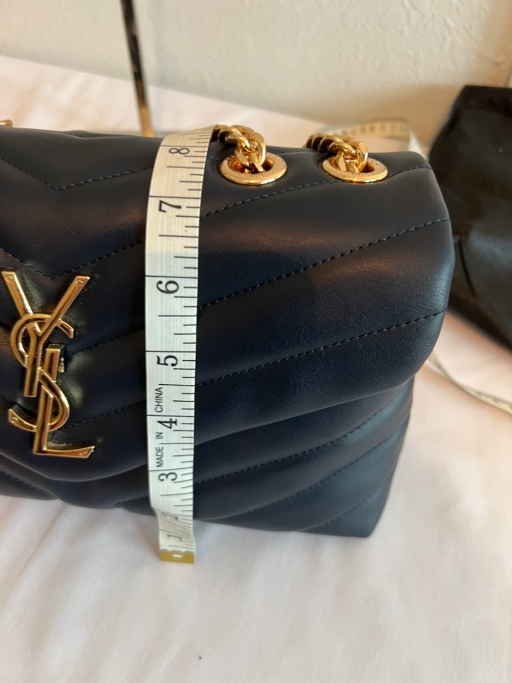 Yves Saint Laurent Navy Blue with gold tone chain and emblem. - Picture 10 of 11